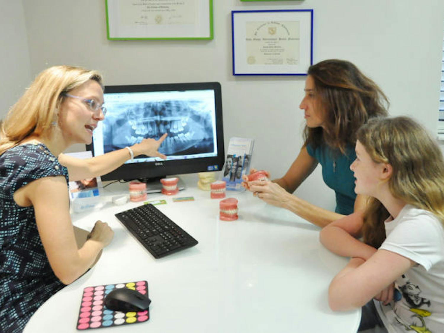 Dr. Nicole Mullally speaks to Cameron Varvel, 10, about braces. Mullally described the best way to maintain and clean braces using a 3-D instructional video.