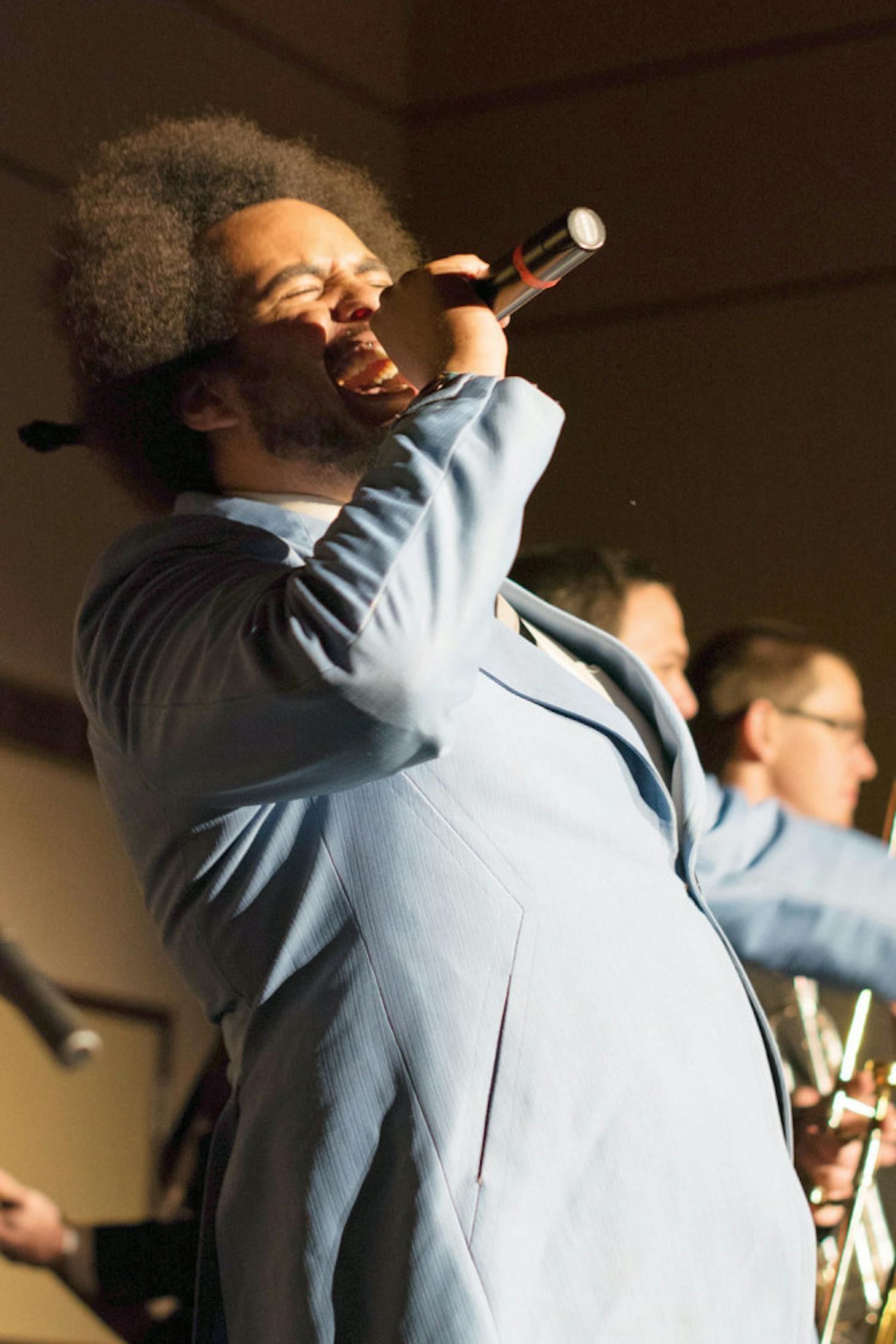 Justin McKenzie, the 25-year-old lead male singer, sings with his band The Savants of Soul in the Reitz Union Grand Ballroom on Tuesday night. The Savants of Soul are a 10-member local band that plays soul music.