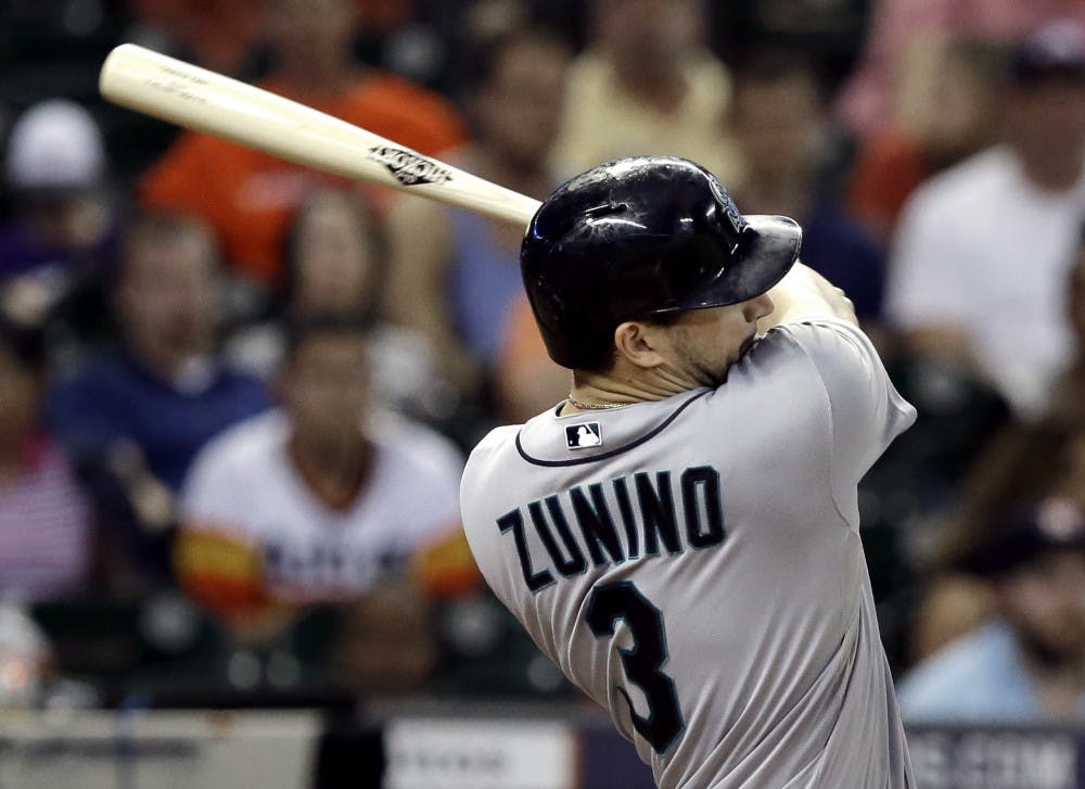 <p>Mike Zunino smacks a three-run home run during the Seattle Mariners 10-5 win against the Houston Astros on Sept. 19, 2014.</p>