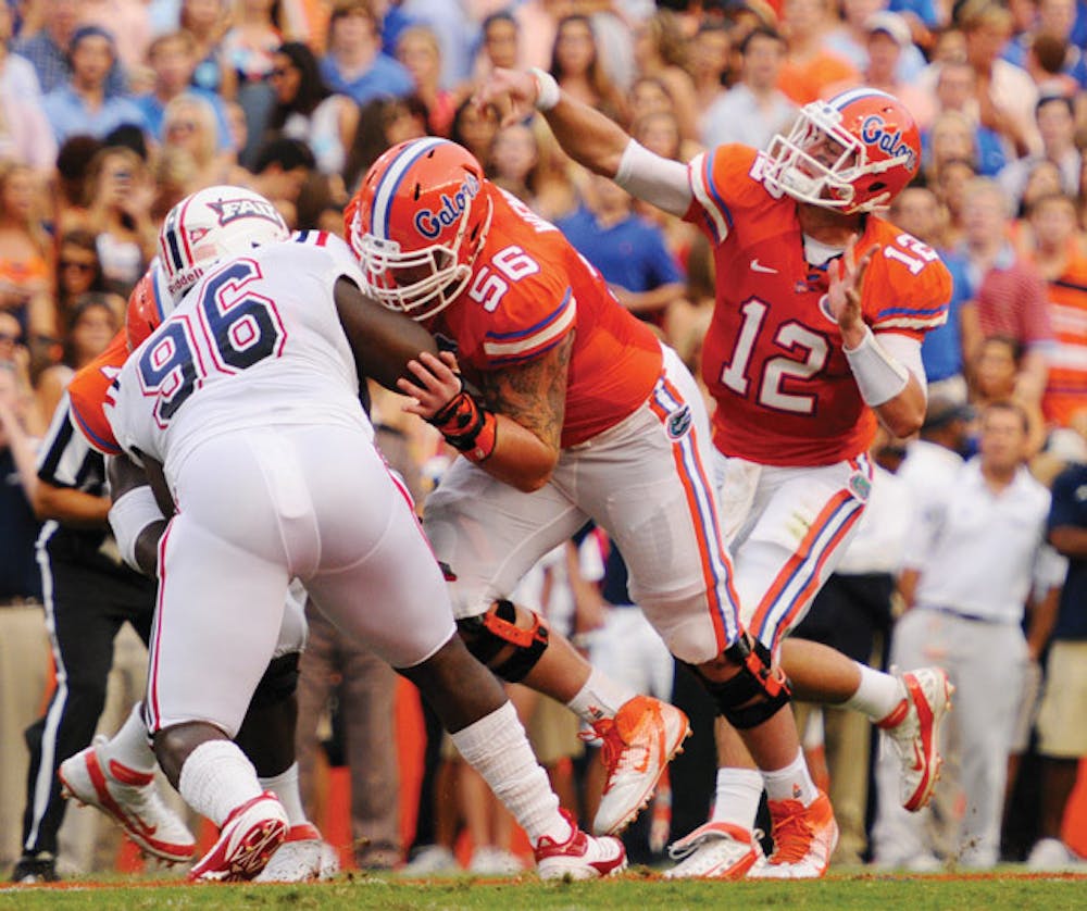 <p>Gators offensive lineman Dan Wenger (56), a sixth-year senior who transferred from Notre Dame during the summer, is no longer worried about the concussions he suffered a year ago. Wenger has experience with offensive line coach Frank Verducci and coordinator Charlie Weis from his time with the Irish.</p>