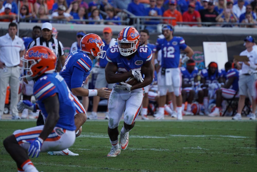 <p>Jordan Scarlett runs with the ball during Florida's 24-10 win against Georgia on Oct. 29, 2016, at EverBank Field in Jacksonville.</p>
