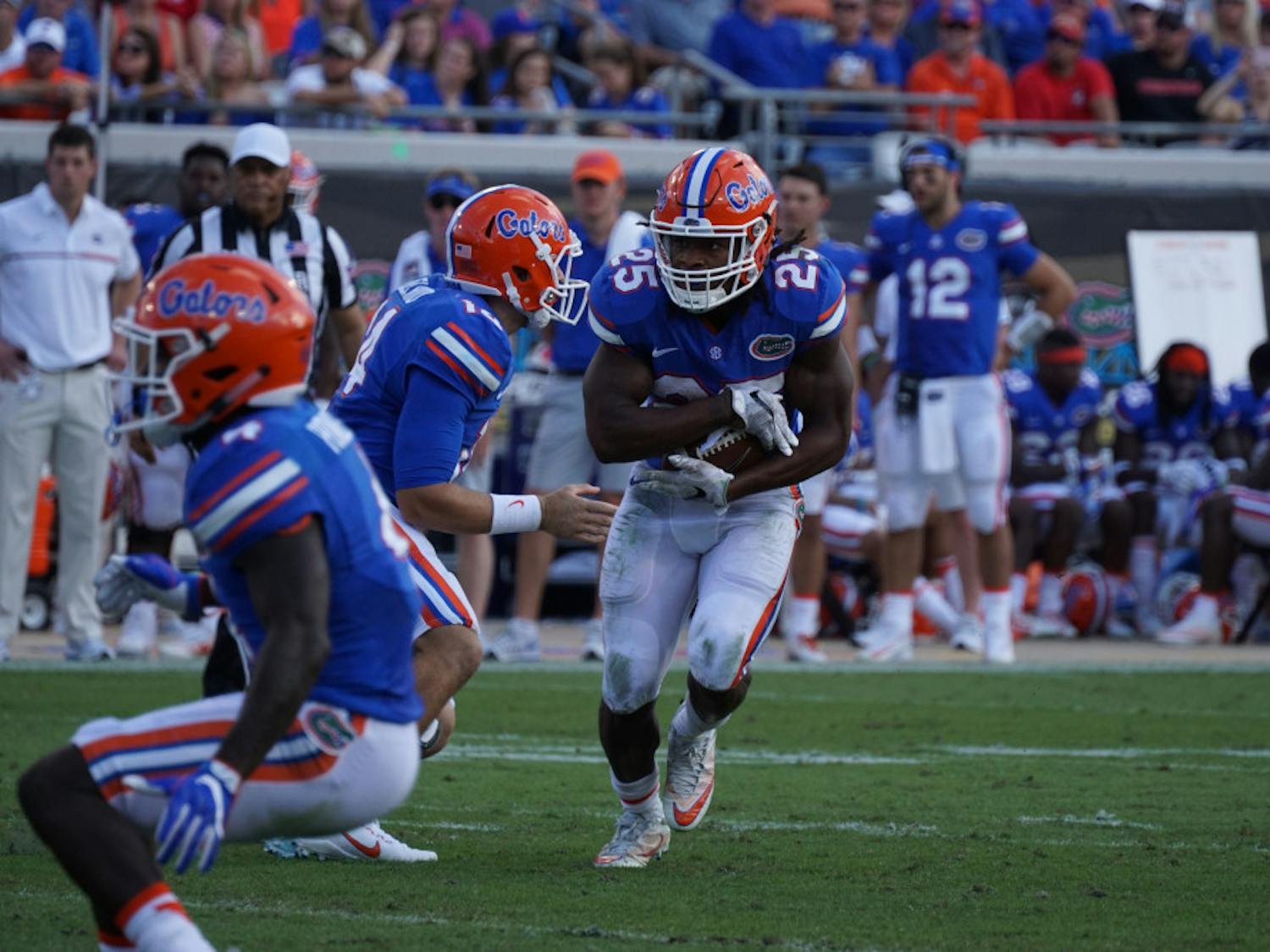 Jordan Scarlett runs with the ball during Florida's 24-10 win against Georgia on Oct. 29, 2016, at EverBank Field in Jacksonville.