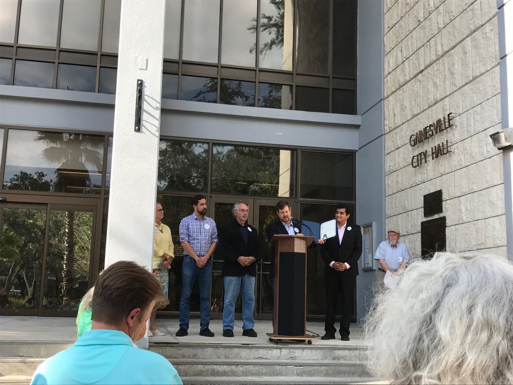 Mayor Lauren Poe displays the Welcoming Week Proclamation along with Gainesville City Commissioners Helen Warren, Adrian Hayes-Santos, Harvey Budd and David Arreola. This is the second Welcome Week held by the City of Gainesville.