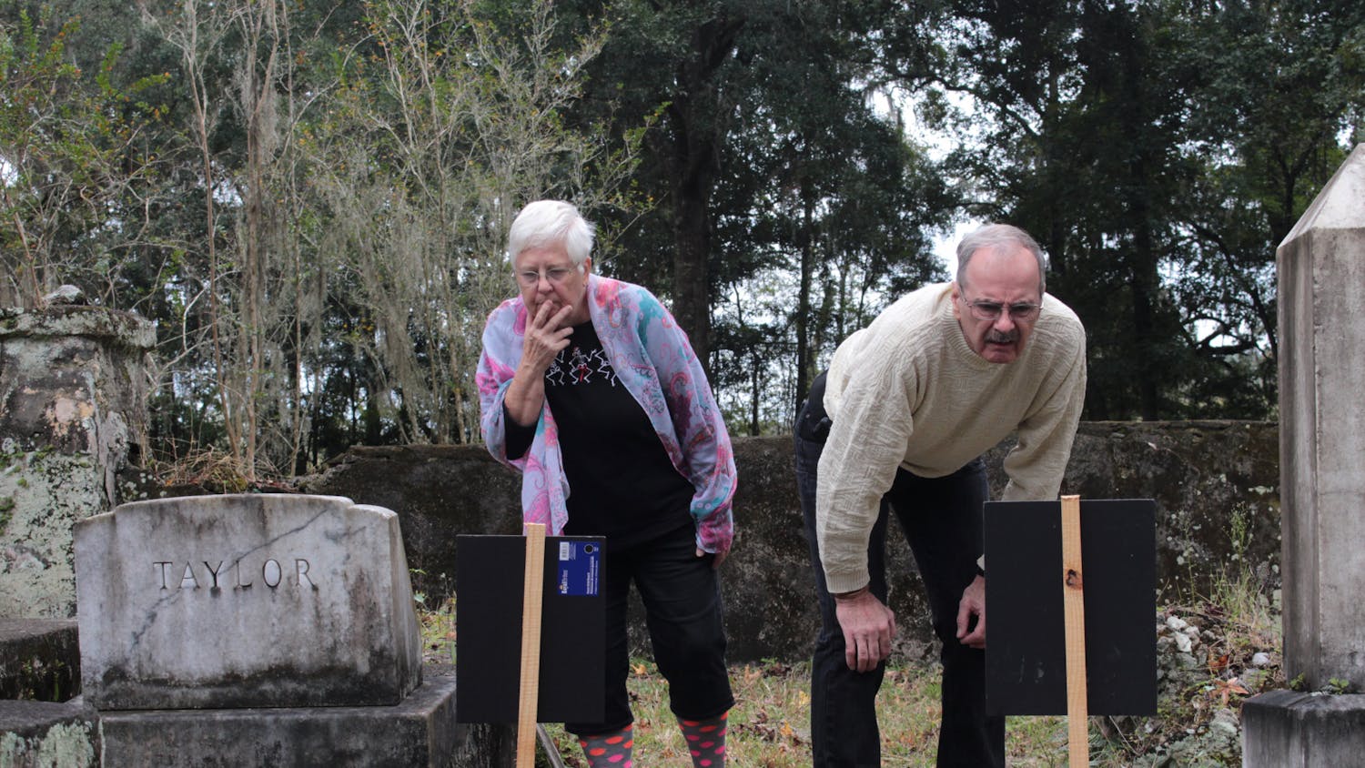 Linda and Robert Kasicki look at some of the oldest graves in Kanapaha Presbyterian Church Cemetery on Sunday, Oct. 31, 2021.