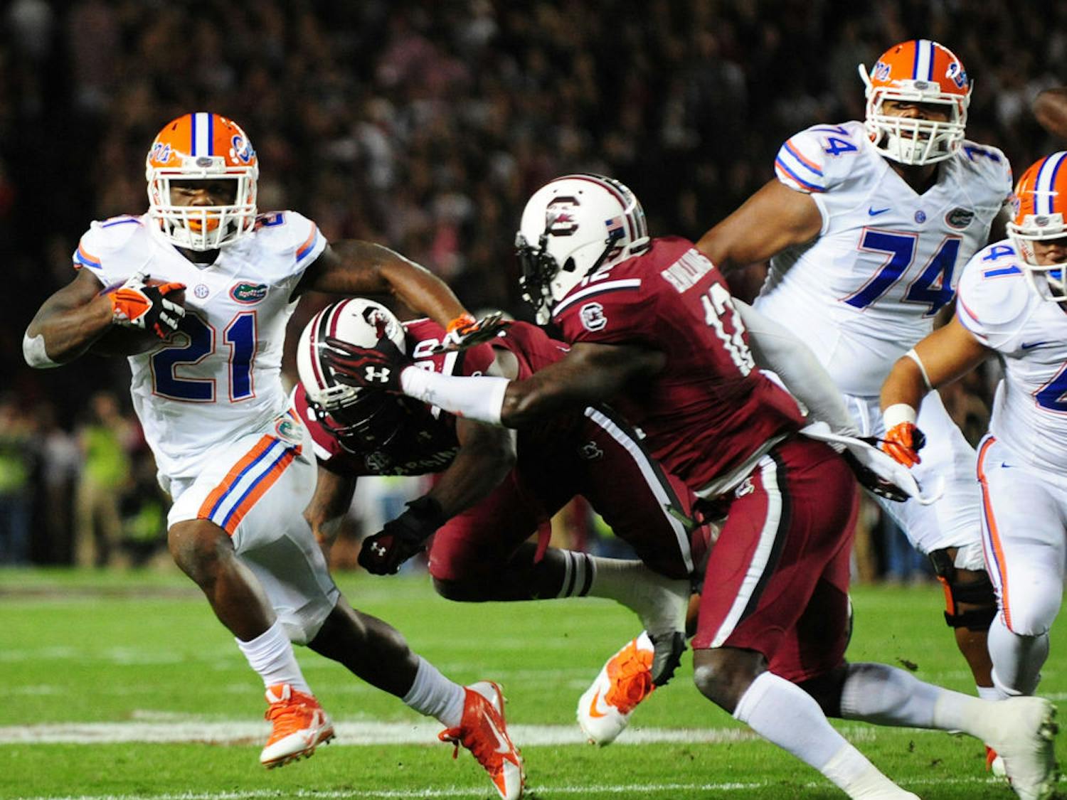 Running back Kelvin Taylor (21) rushes for a touchdown during Florida’s 19-14 loss to South Carolina on Nov. 16 at Williams-Brice Stadium in Columbia, S.C.