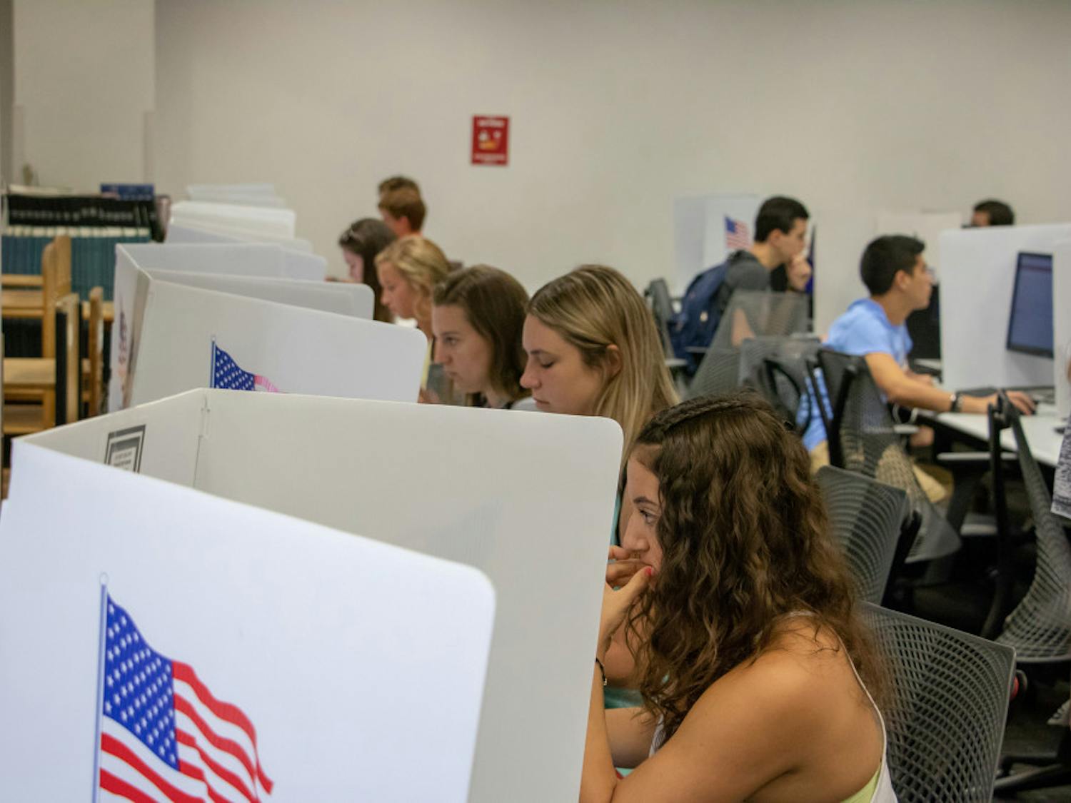 Students sit at voting stations at the Marston Science Library computer lab polling location and cast their votes for last Fall's Student Government elections on Sept. 25. Marston is one of several locations students can vote at on Wednesday.