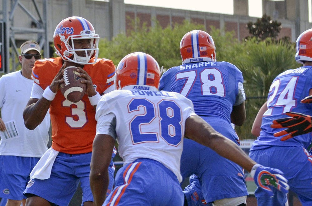 <p>Treon Harris drops back to pass during practice on Monday.</p>