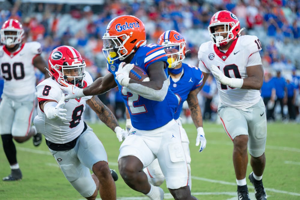 Running back Montrell Johnson rumbles through the defense in the Gators’ 43-20 loss against the Georgia Bulldogs on Saturday, Oct. 28, 2023.