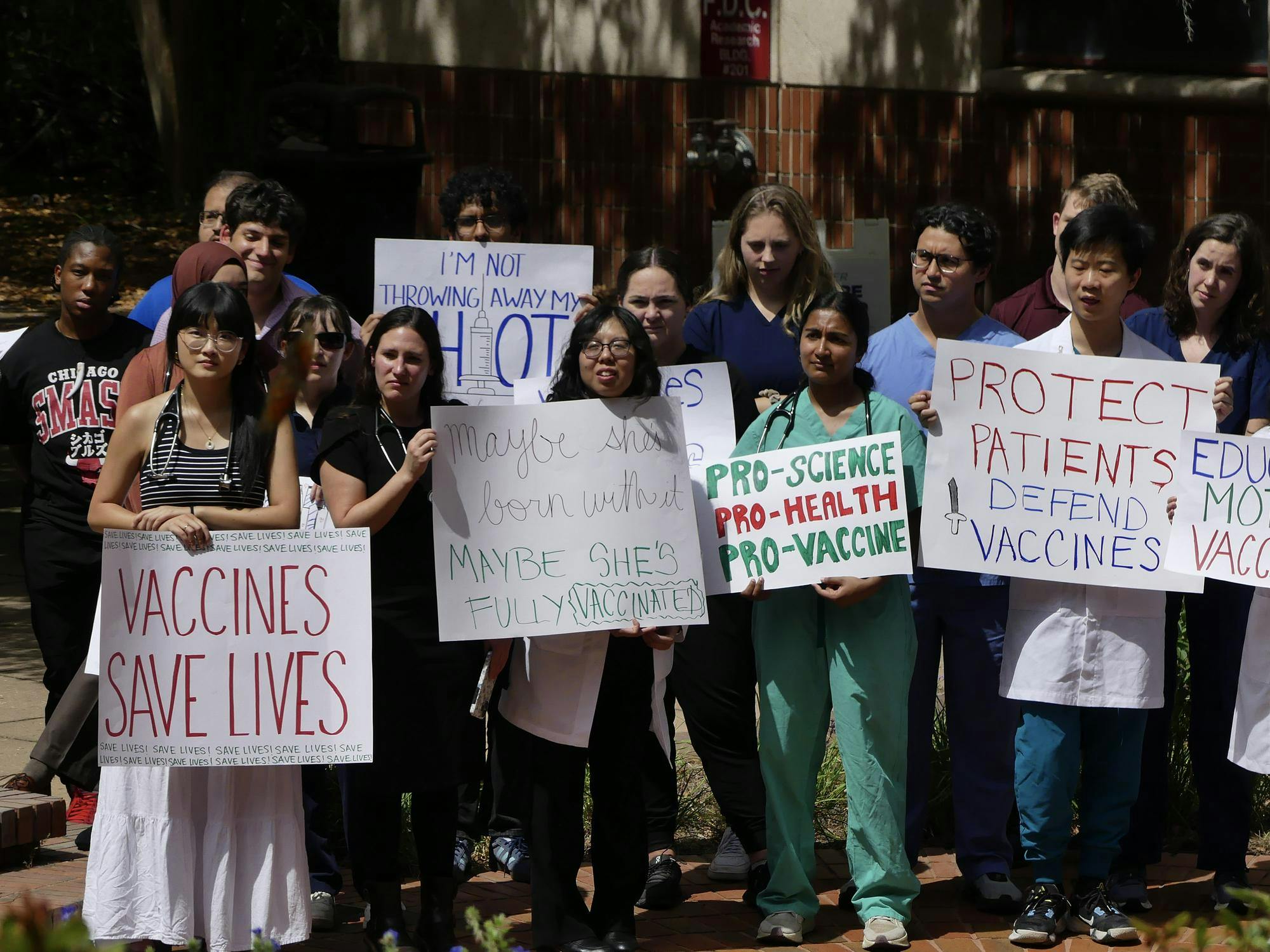 Students protest recent changes to Florida’s vaccine requirements in front of the College of Medicine on Sept. 12, 2025.