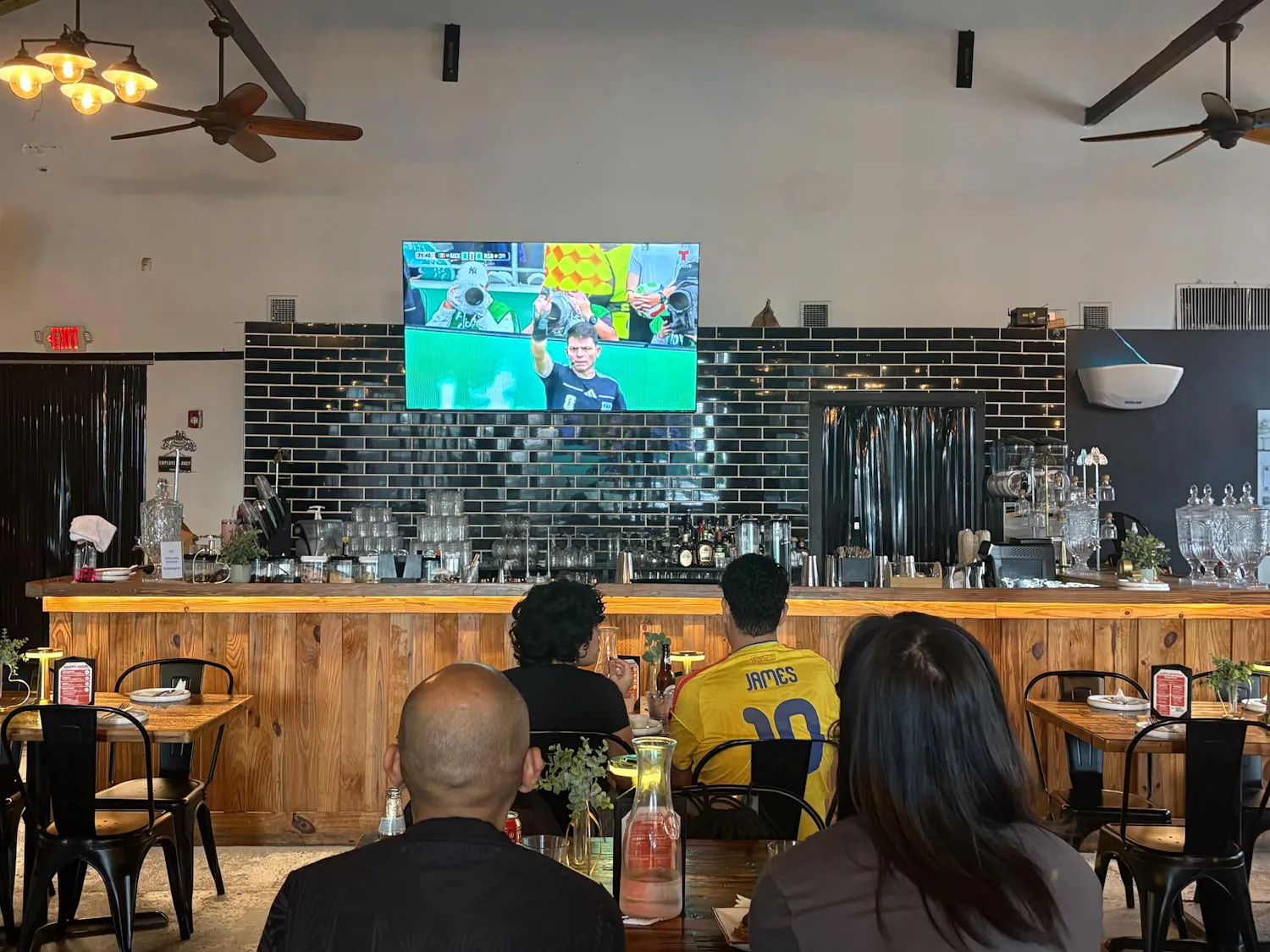 Diners watch the second half of the first World Cup match between Mexico and South Africa at Tinker Restaurant, Thursday, June 11, 2026, in Gainesville, Fla.