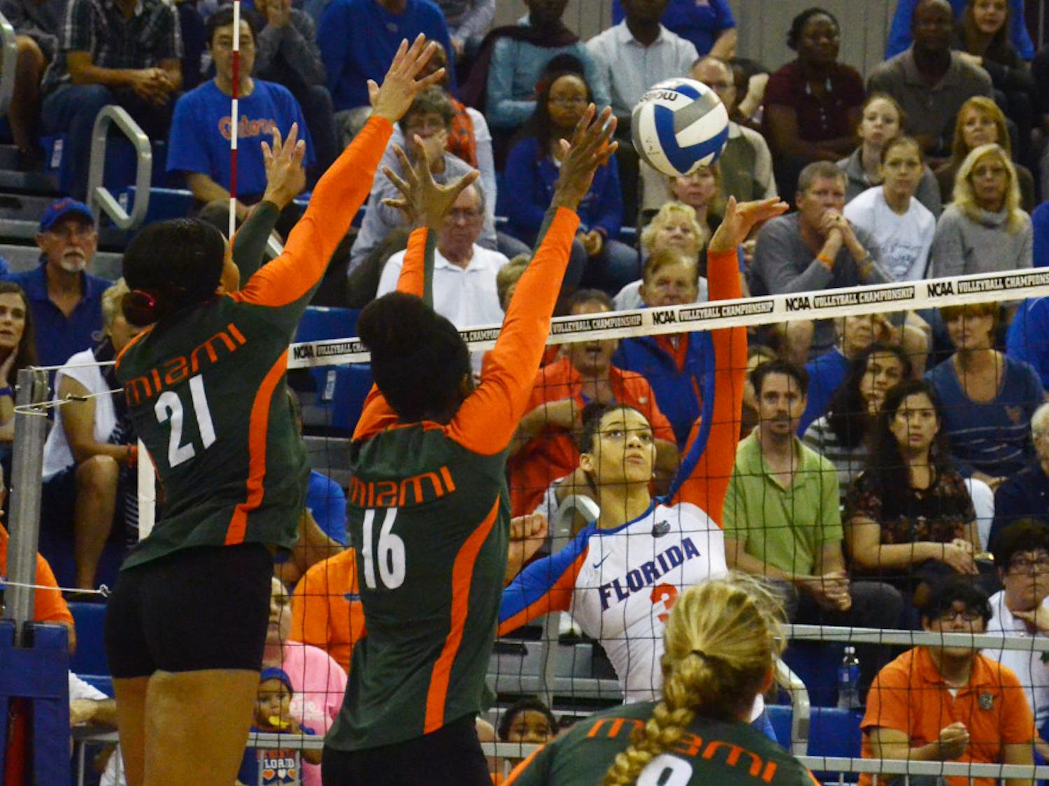Sophomore right-side hitter Alex Holston swings for a kill attempt during No. 8 seed Florida's 3-1 win against Miami in the second round of the NCAA Tournaent on Saturday in the O'Connell Center.