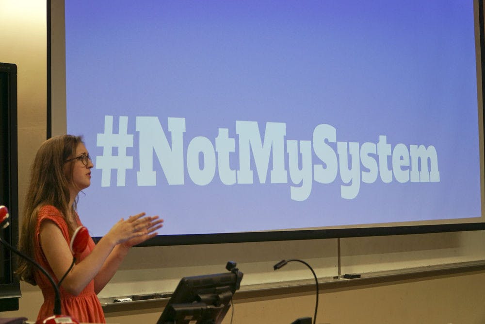 <p dir="ltr">Sabrina Philipp takes questions during the Not My System town hall meeting at Turlington Hall on Feb. 16, 2016. On Tuesday, she hosted an online Q&amp;A.</p>