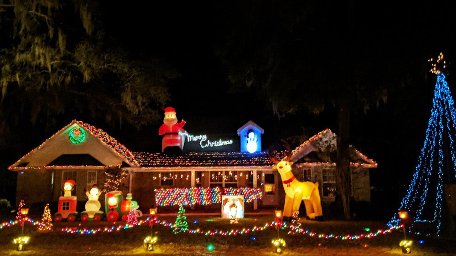 Logan Euler, 19, runs a light show at his dad's house in Newberry, Fla. Starting Dec. 3, 2020, cars can tune into a radio station as they drive by to hear the curated music and messages from the show every night from 6-9 p.m. Sunday-Thursday and 6 p.m. to 12 a.m. on Fridays and Saturdays.