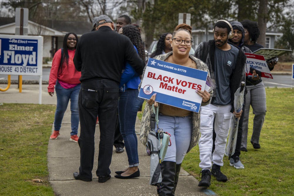 <p>Fayetteville State University students and members of the Black Voters Matter organization at the Smith Recreation Center polling site in Fayetteville, N.C., on Tuesday, March 3, 2020. Fayetteville State students were there to vote in North Carolina's Super Tuesday primaries. (Paul Woolverton/The Fayetteville Observer via AP)</p>