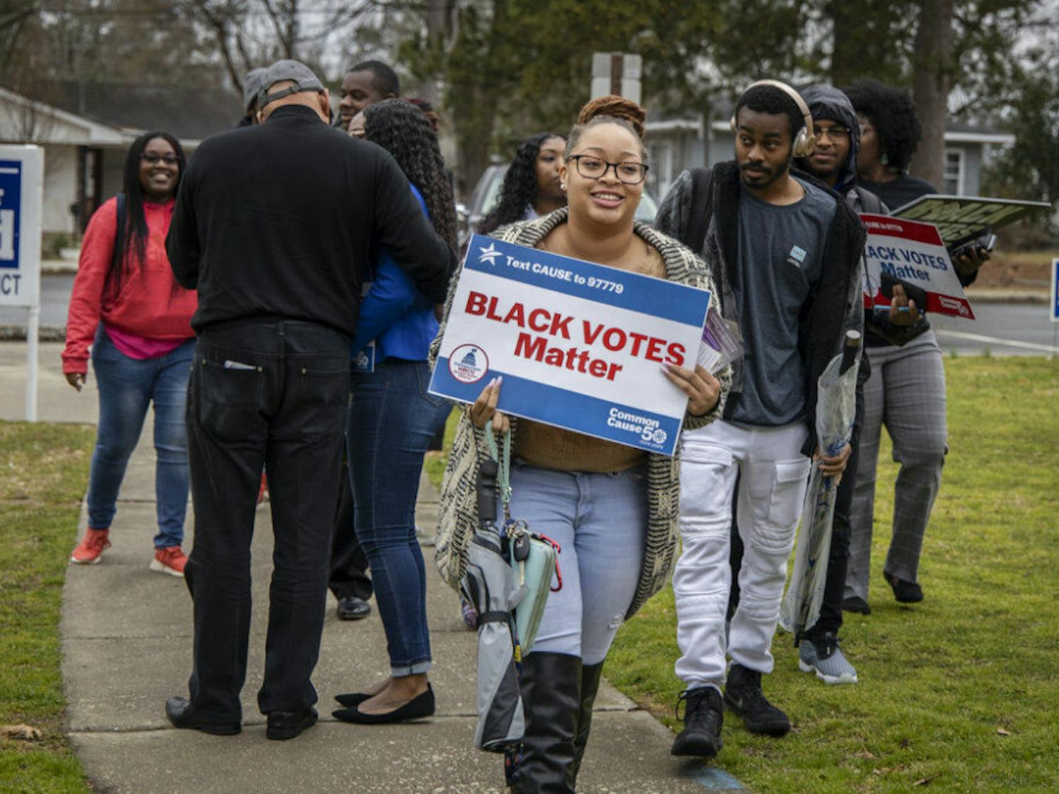 Fayetteville State University students and members of the Black Voters Matter organization at the Smith Recreation Center polling site in Fayetteville, N.C., on Tuesday, March 3, 2020. Fayetteville State students were there to vote in North Carolina's Super Tuesday primaries. (Paul Woolverton/The Fayetteville Observer via AP)