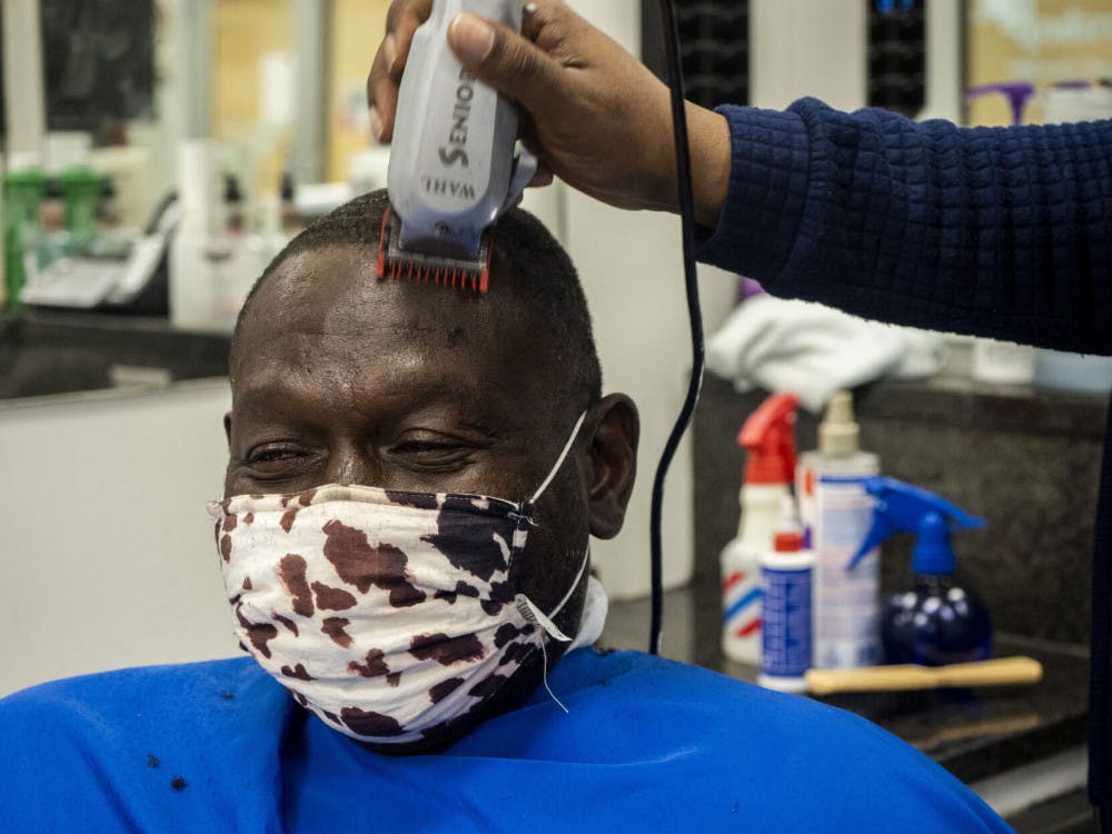 A picture of John Smith getting a hair cut