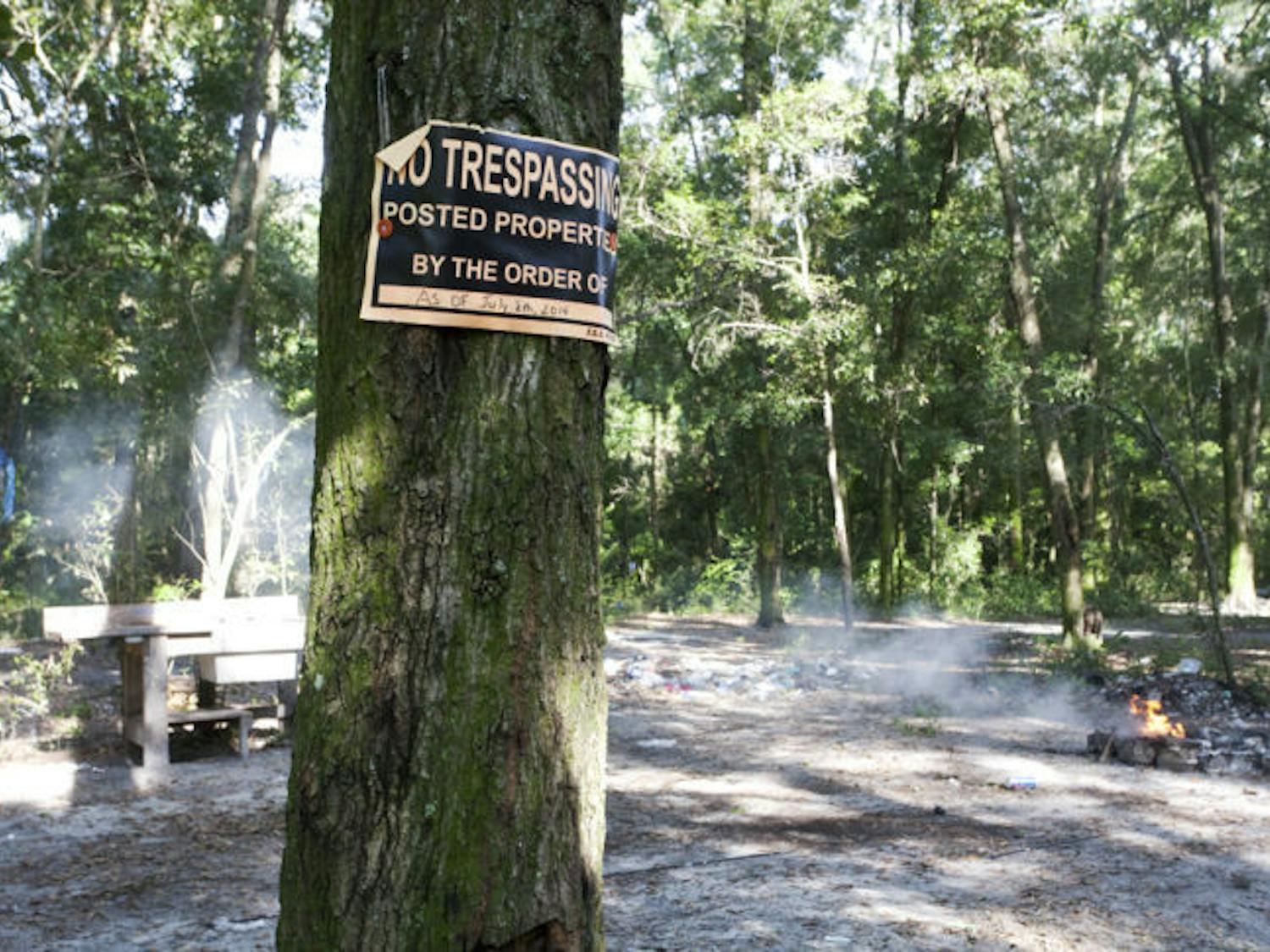 A sign posted by the Gainesville Police declares the date it will start removing unauthorized residents from the property south of Depot Avenue, known as tent city.