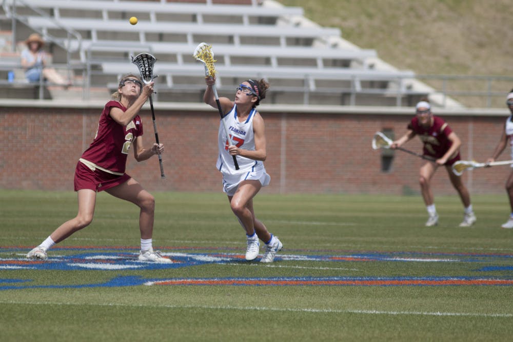 UF attacker Mollie Stevens fights for the ball during Florida's 15-8 win against Denver on March 28, 2017, at Donald R. Dizney Stadium.
