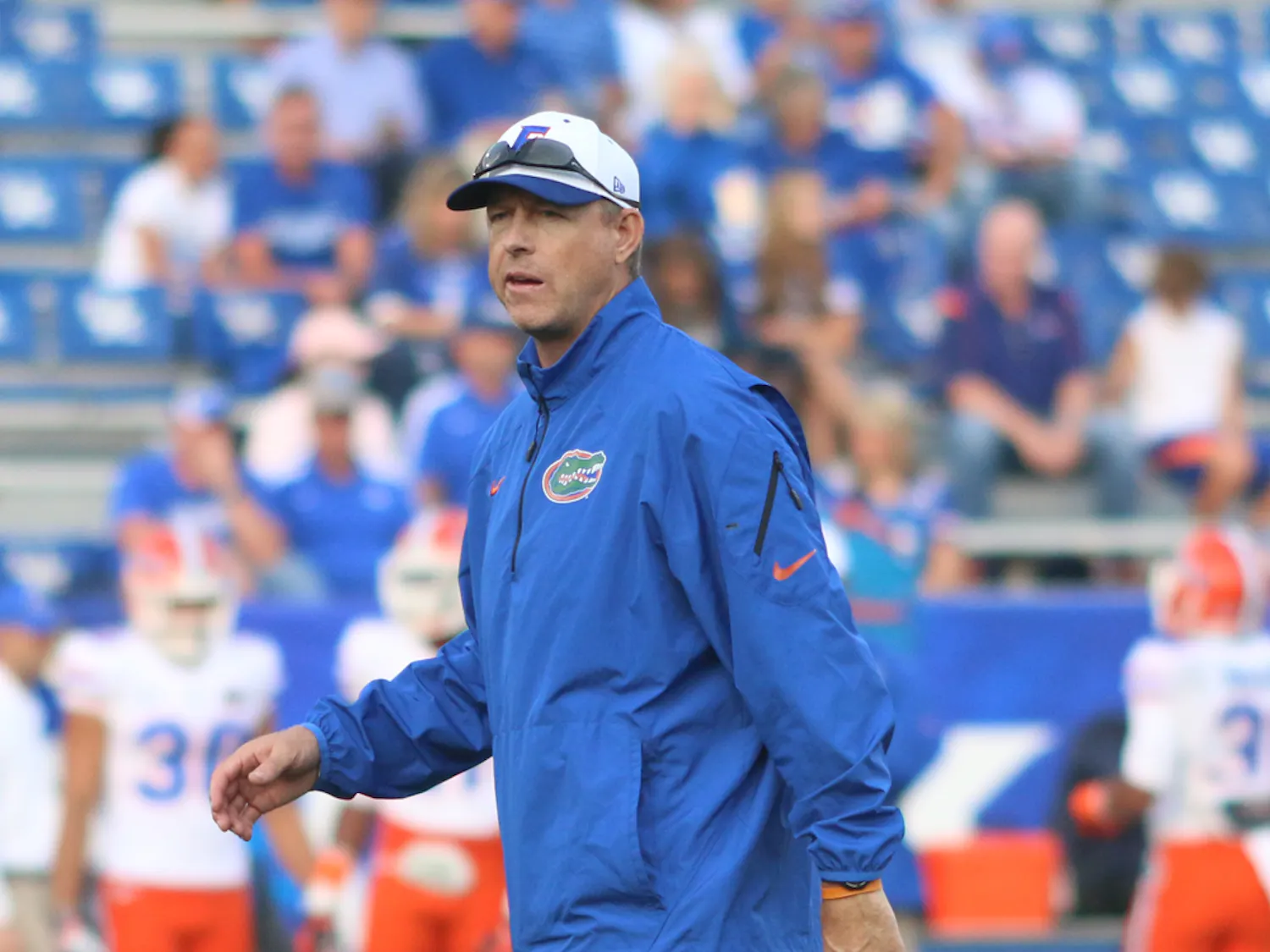 Brent Pease walks on the field and watches warm-ups prior to Florida’s 24-7 victory against Kentucky on Saturday at Commonwealth Stadium in Lexington, Ky. Florida’s second-year offensive coordinator took the Gators’ quarterbacks for a nature walk near their hotel prior to the game.