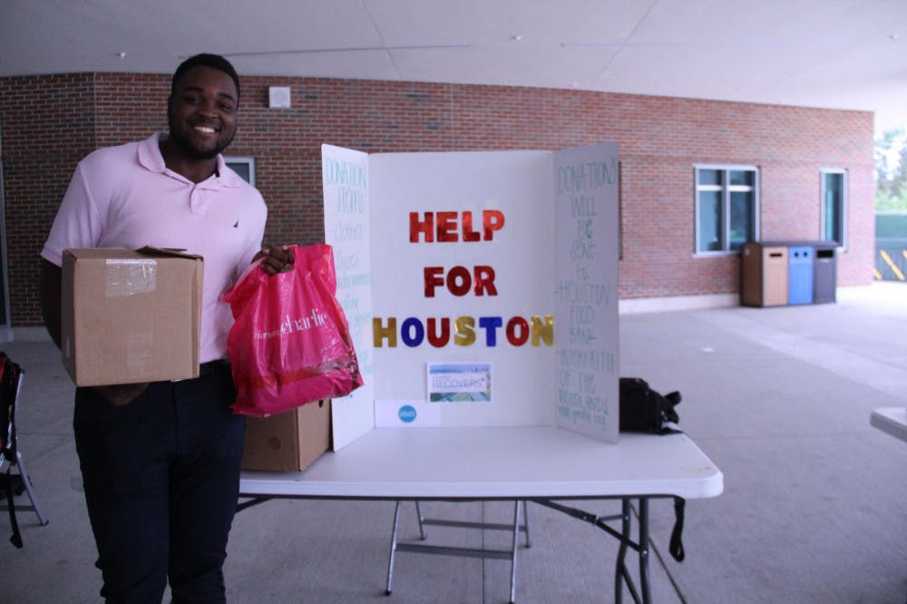 Derrick Kerr, a 20-year-old UF mechanical engineering junior, stands outside of the Reitz Union to collect donations for Harvey victims. He is volunteering with Help For Houston.