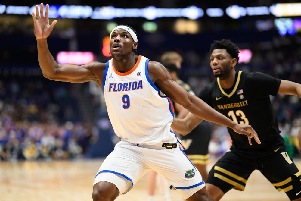 Florida center Rueben Chinyelu (9) move to the ball during the first half of an SEC Men's Basketball Tournament semifinal game against Vanderbilt, Saturday, March 14, 2026, in Nashville, Tenn.
