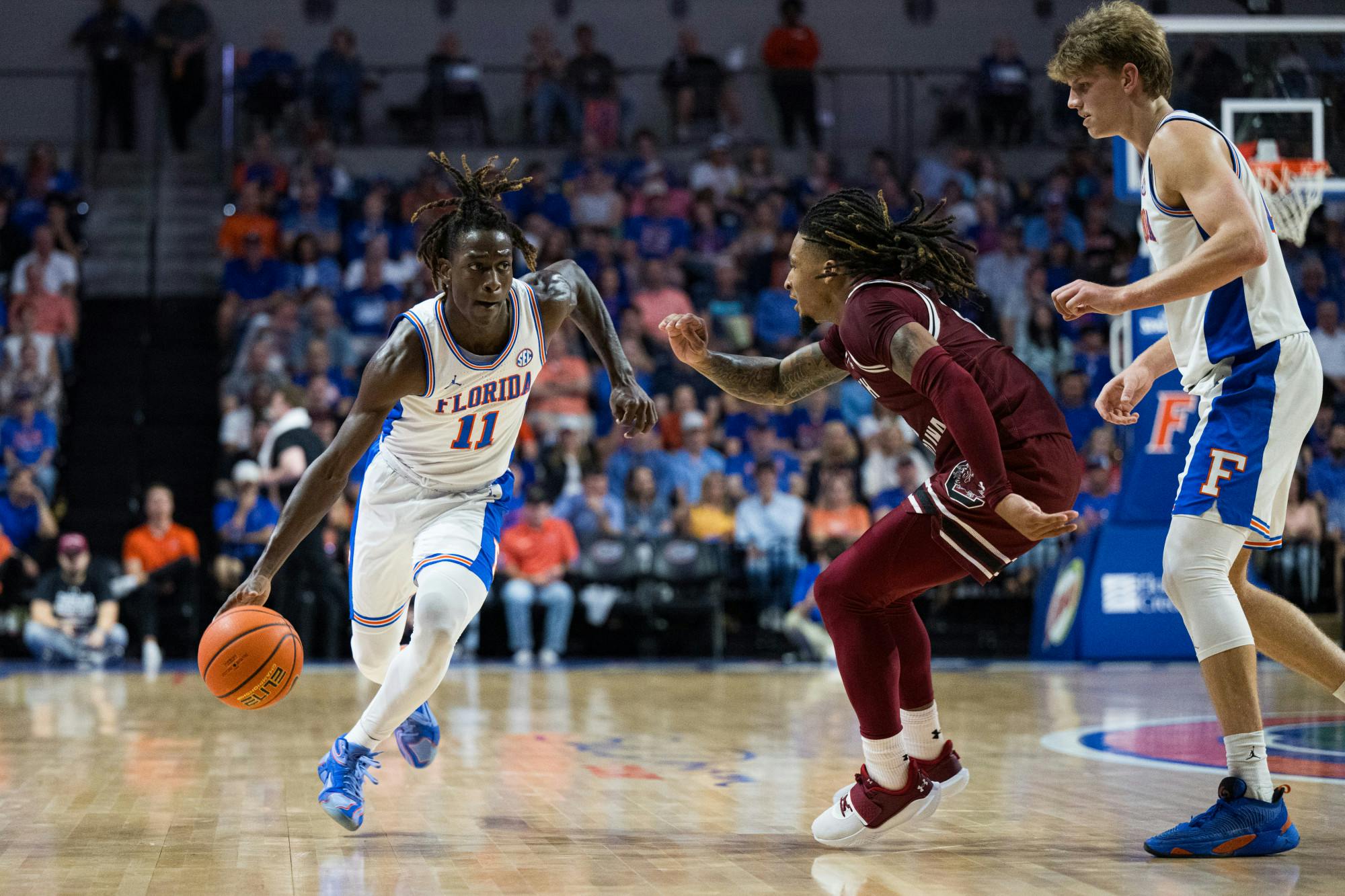 Florida Gators guard Denzel Aberdeen (11) drives with the ball in a basketball game against South Carolina on Saturday, Feb. 15, 2025, in Gainesville, Fla.