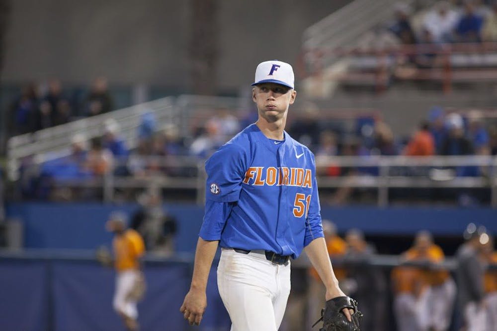 <p>UF pitcher Brady Singer walks off the field during Florida's 3-2 loss to Tennessee on April 8, 2017, at McKethan Stadium.</p>