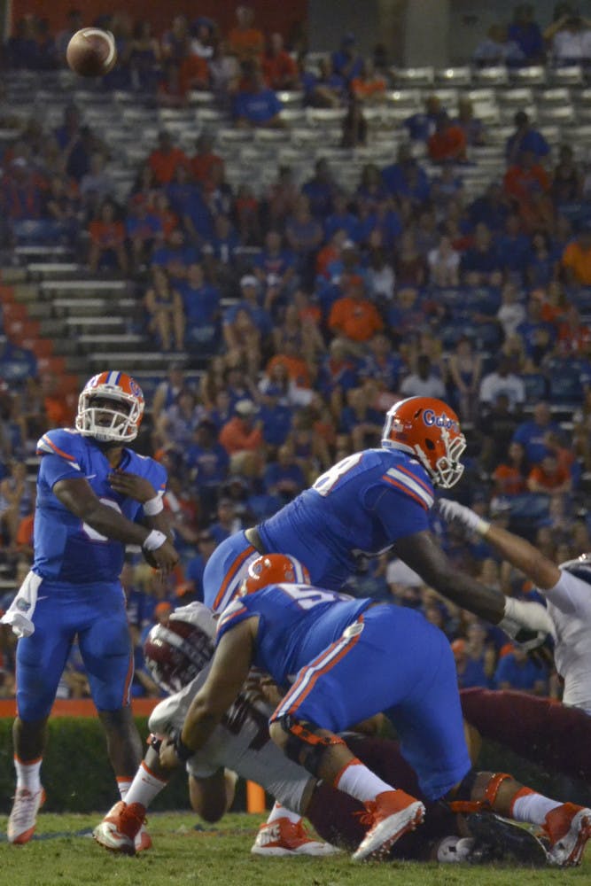UF quarterback Treon Harris passes during Florida's 61-13 win against New Mexico State on Saturday at Ben Hill Griffin Stadium.
