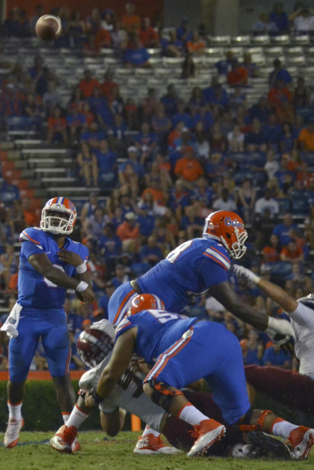 <p>UF quarterback Treon Harris passes during Florida's 61-13 win against New Mexico State on Saturday at Ben Hill Griffin Stadium.</p>