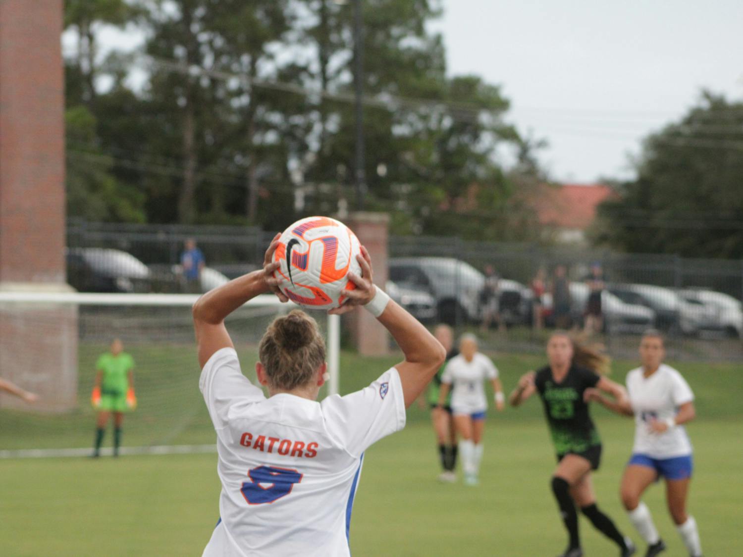 Florida junior defender Josie Curtis throws the ball into play during the Gators' match against South Florida Sept. 1, 2021. 