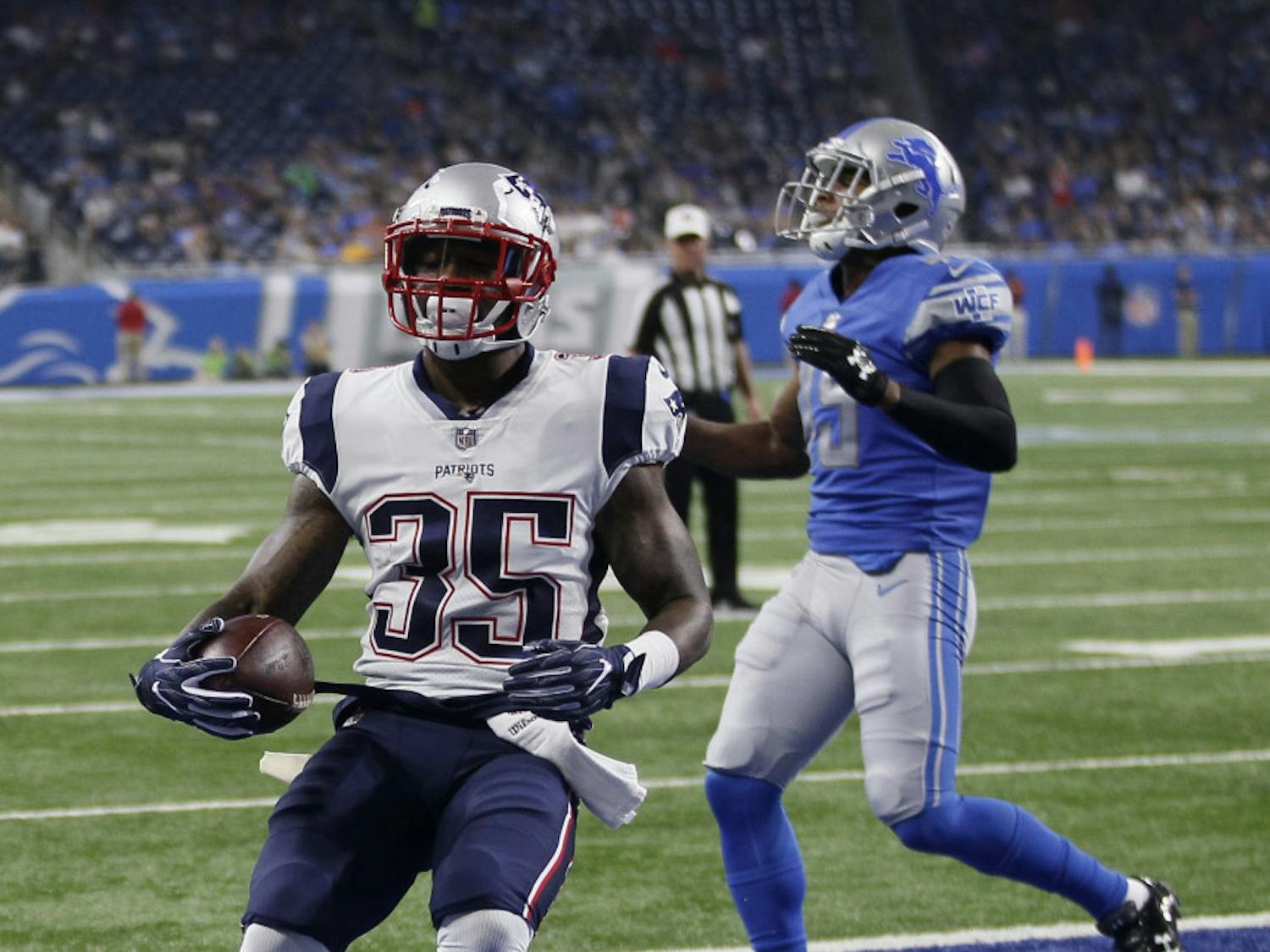 New England Patriots running back Mike Gillislee (35) runs into the end zone for a 1-yard touchdown during the first half of an NFL preseason football game against the Detroit Lions, Friday, Aug. 25, 2017, in Detroit. (AP Photo/Duane Burleson)
