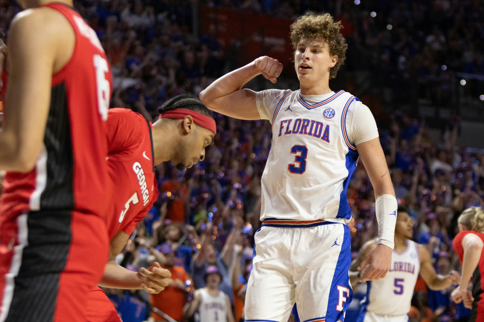 Gators men's basketball center Micah Handlogten flexes after a basket in Florida's 102-98 victory over Georgia Saturday, January 27, 2024. 