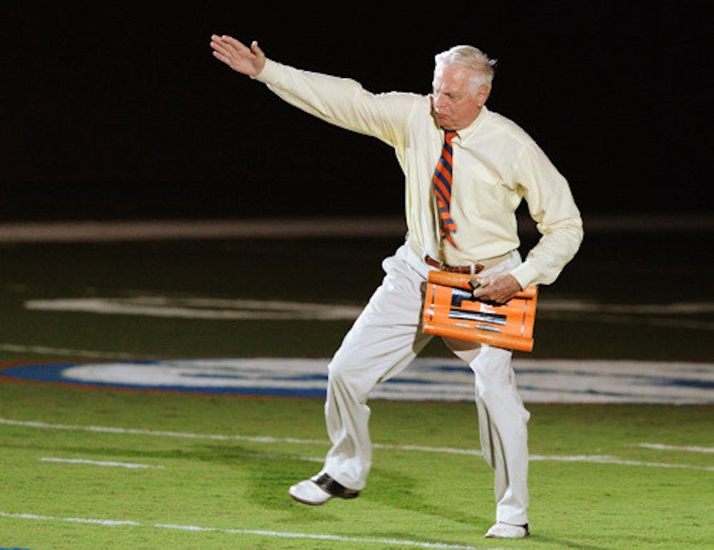 <p>George Edmondson Jr., also known as Mr. Two-Bits, leads the stadium in his signature cheer during during Gator Growl 2008.</p>