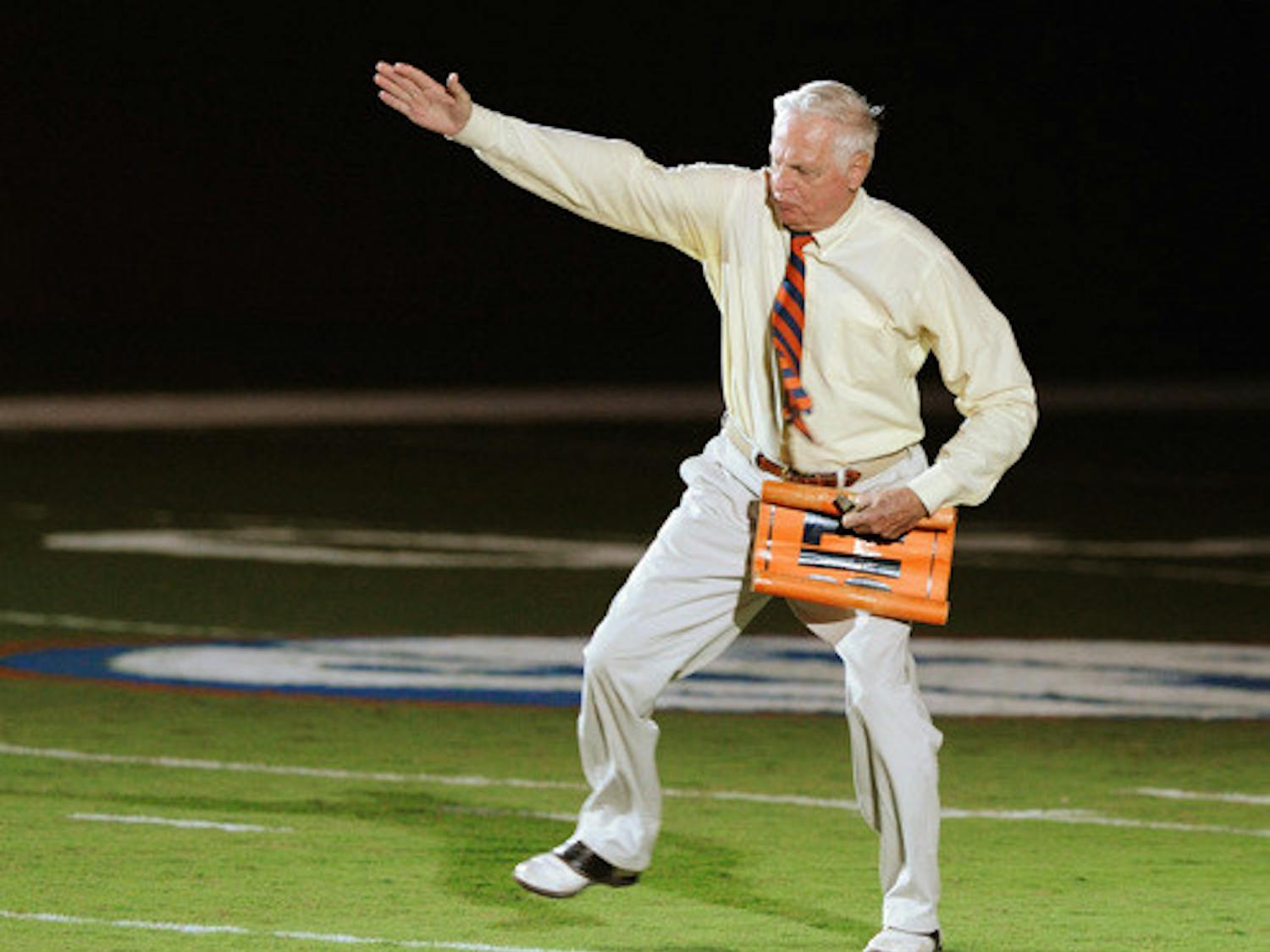 George Edmondson Jr., also known as Mr. Two-Bits, leads the stadium in his signature cheer during during Gator Growl 2008.
