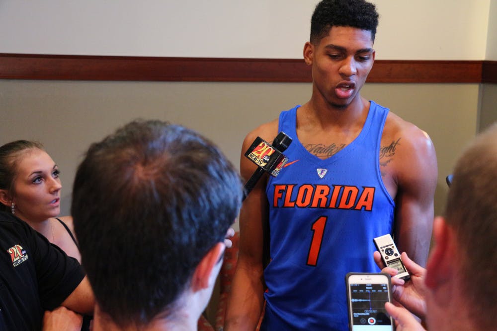 <p>Devin Robinson talks with reporters during Florida's Media Day on Oct. 4, 2016.</p>