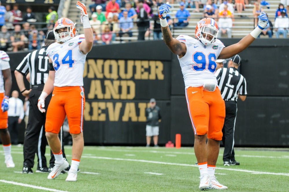 <p>Alex Anzalone (34) and CeCe Jefferson (96) motion to the crowd during Florida's 13-6 win over Vanderbilt on Oct. 1 in Nashville. "He doesn't hold anything back," linebacker Jarrad Davis said of Anzalone. "He lets everything go, and that's what we want from our teammates."</p>