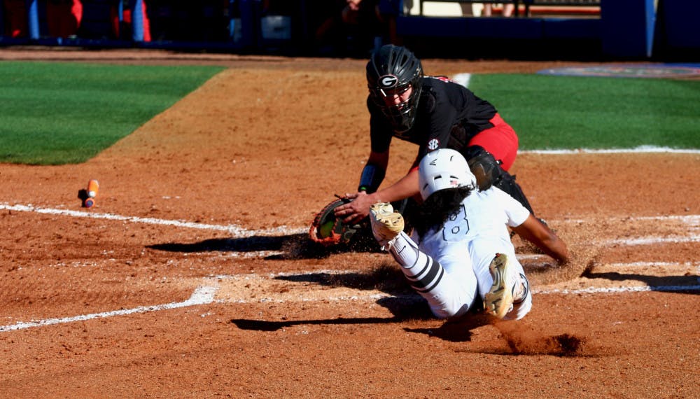 <p><span id="docs-internal-guid-0b7e71f2-1a65-dece-f5eb-6bbe64dd5a8b"><span>Aleshia Ocasio slides into home plate during Florida's 5-0 win against Georgia on April 8, 2017, at Katie Seashole Pressly Stadium.</span></span></p>