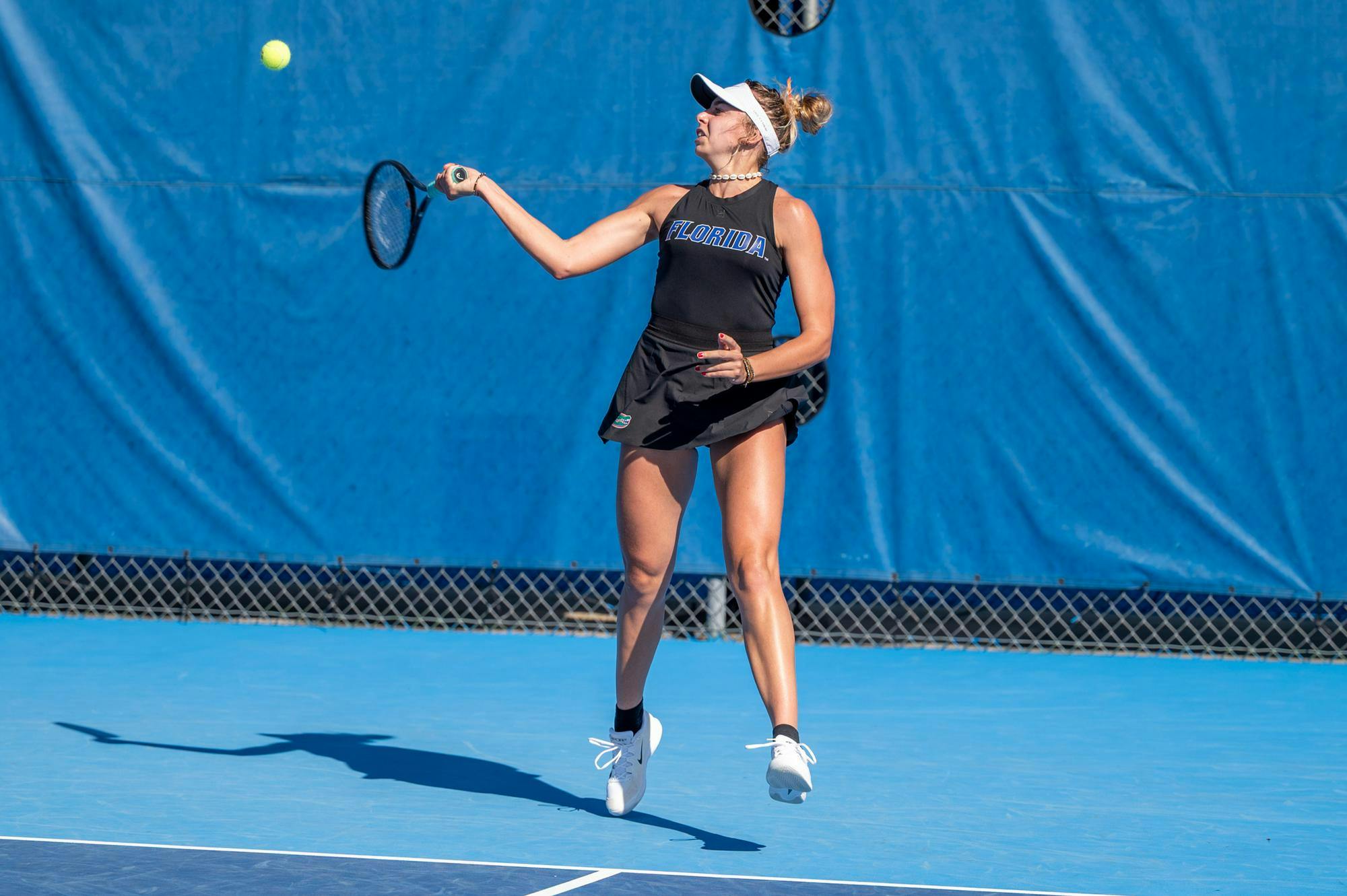 Florida’s Lucie Pawlak hits the ball during an NCAA women’s tennis match against Troy, Friday, Feb. 13, 2026, in Gainesville, Fla.