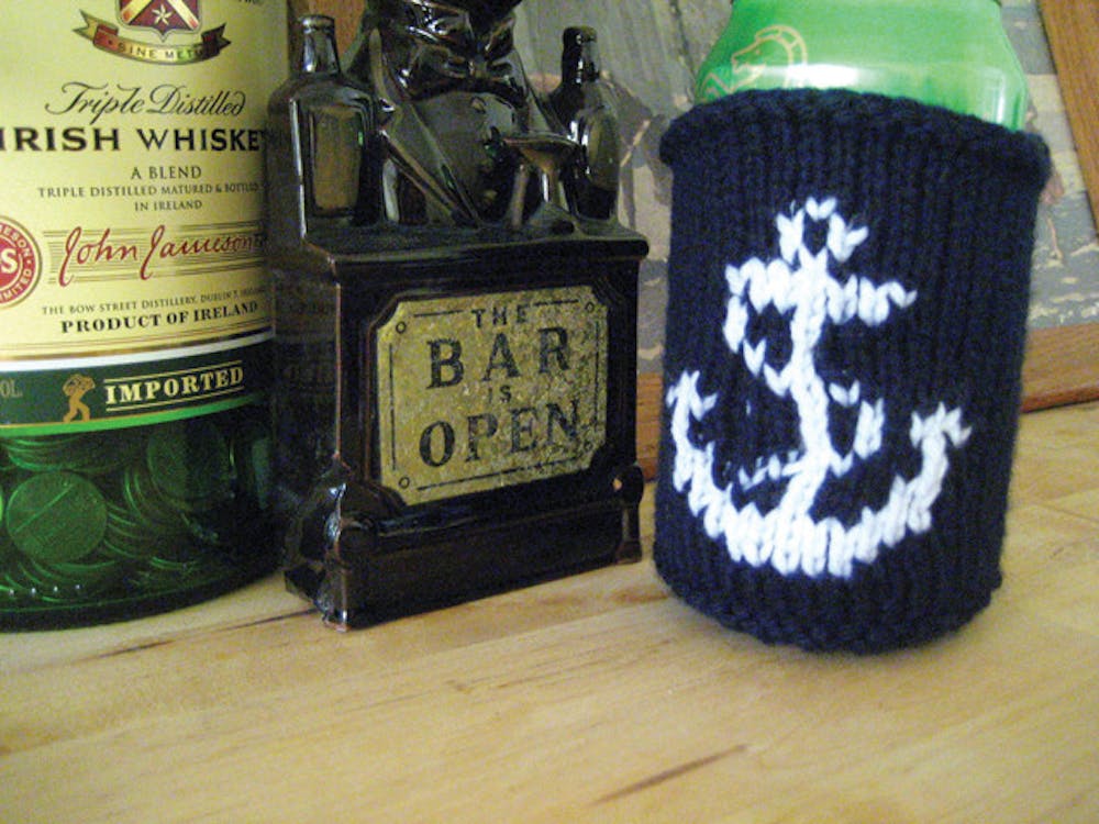 <p>Mary Iserman of Knit At The Bar makes knitted items like this anchor coozie. Iserman will be one of the artists featured at the GLAM Indie Craft Show on Sunday. See story, page 16.</p>