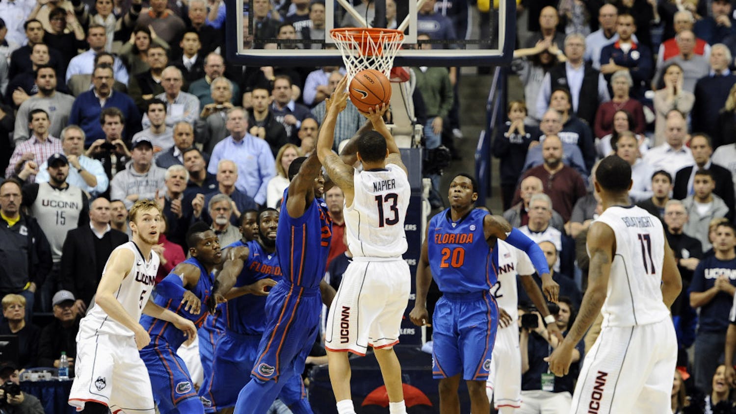 Connecticut's Shabazz Napier (13) goes up for the game winning basket at the buzzer during its 65-64 win against Florida on Monday in Storrs, Conn.