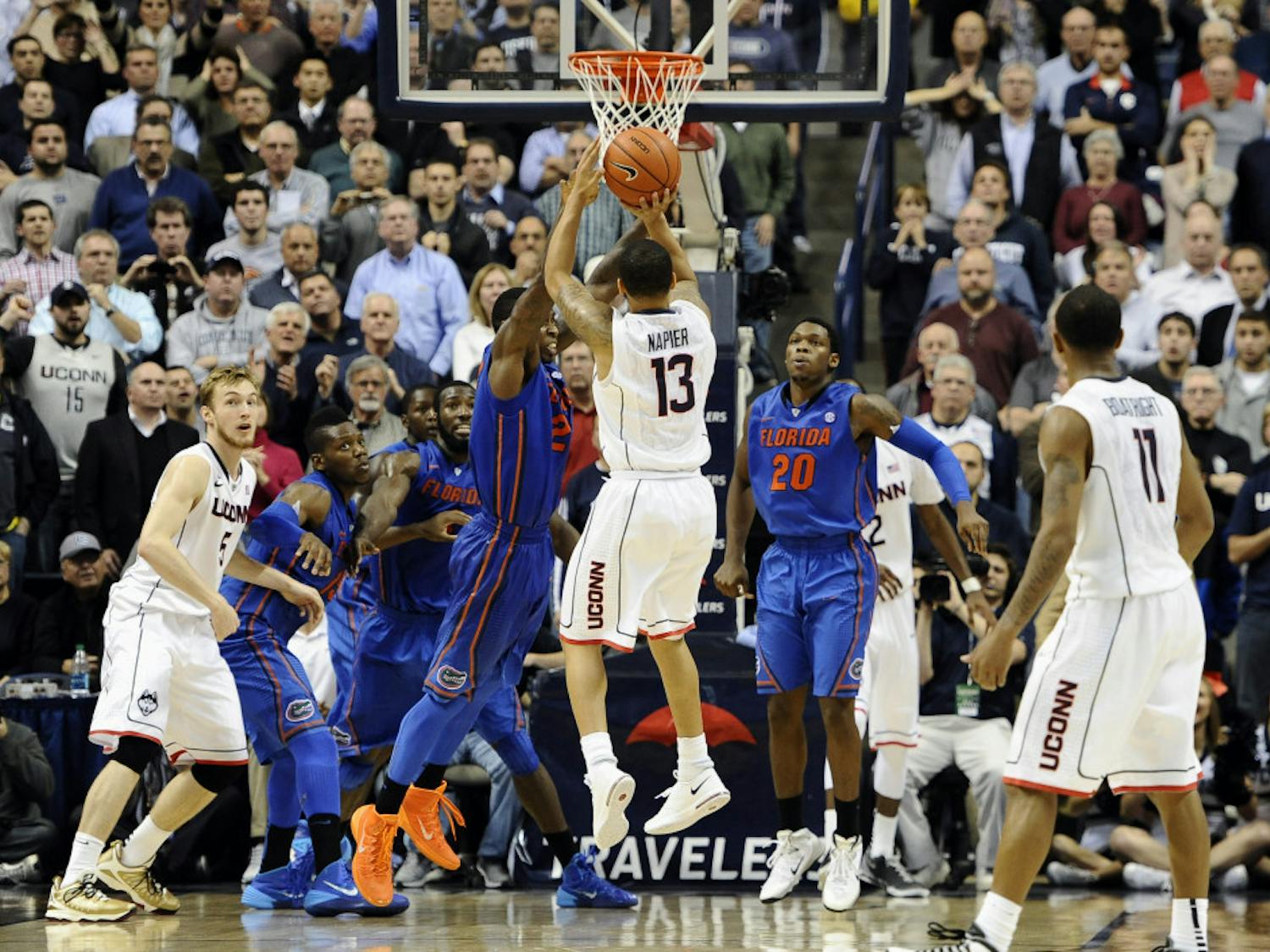 Connecticut's Shabazz Napier (13) goes up for the game winning basket at the buzzer during its 65-64 win against Florida on Monday in Storrs, Conn.