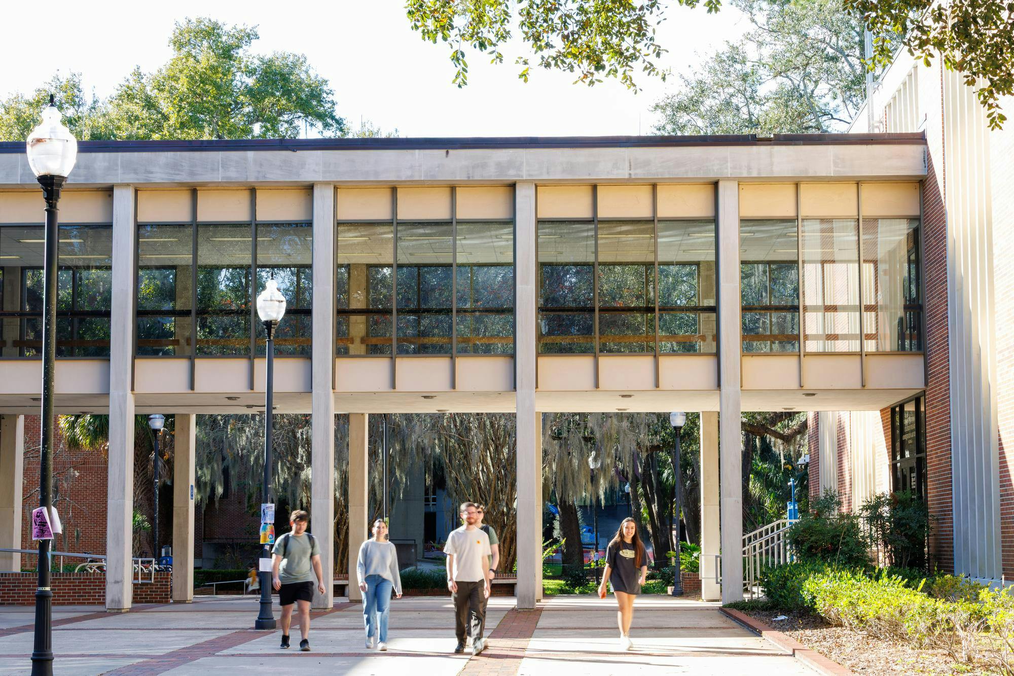 UF students walk in between the fine arts buildings in Gainesville, Fla., Friday, Jan. 23, 2026.