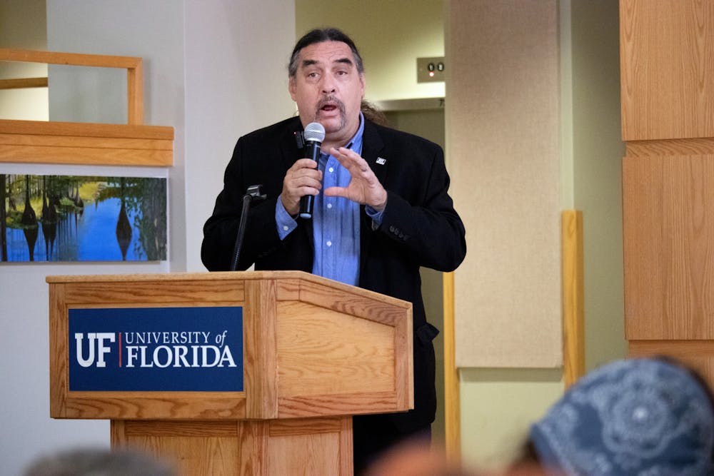 <p>Dr. Paul Ortiz, the director of the Samuel Proctor Oral History Program, welcomes attendees to the talking portion of the Future of Florida Springs event Saturday, April 1, 2023.</p>