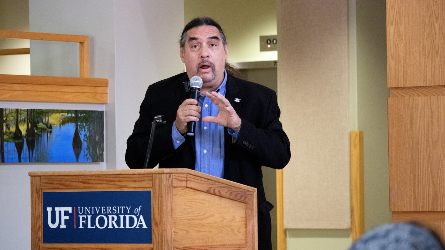 Dr. Paul Ortiz, the director of the Samuel Proctor Oral History Program, welcomes attendees to the talking portion of the Future of Florida Springs event Saturday, April 1, 2023.