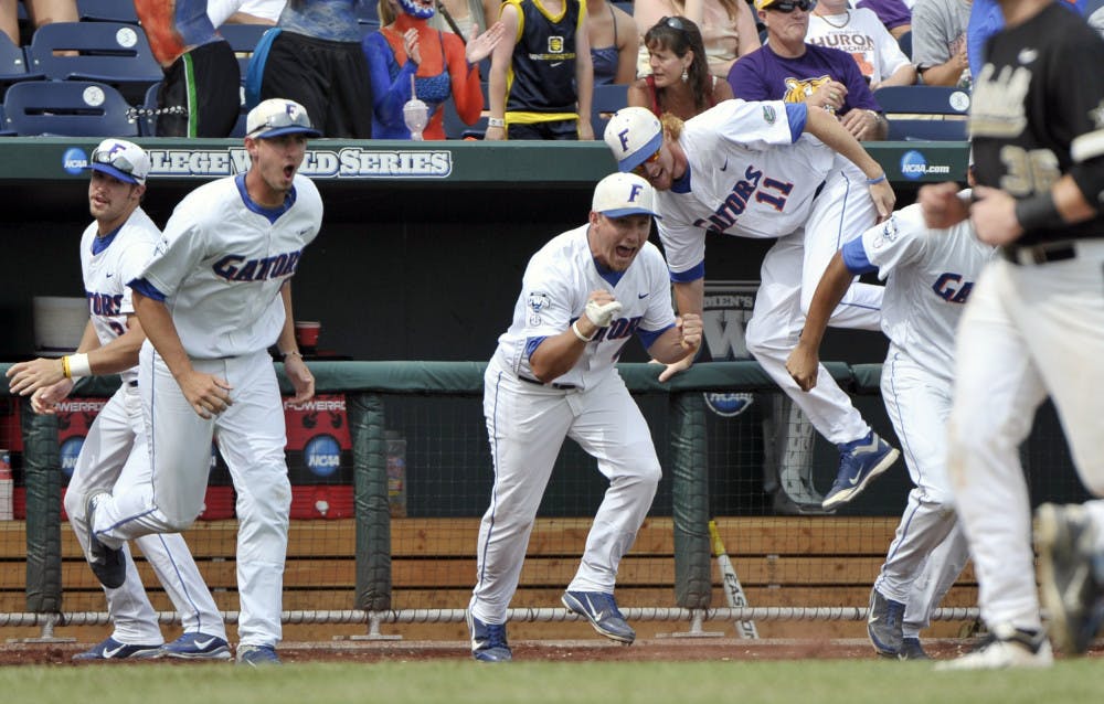 Florida players erupt out of the dugout after defeating
Vanderbilt 6-4 to advance to the CWS championship series. 
