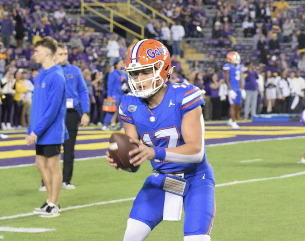 Redshirt freshman quarterback Max Brown warms up before the Gators' 52-35 loss to the LSU Tigers on Saturday, Nov. 11, 2023.