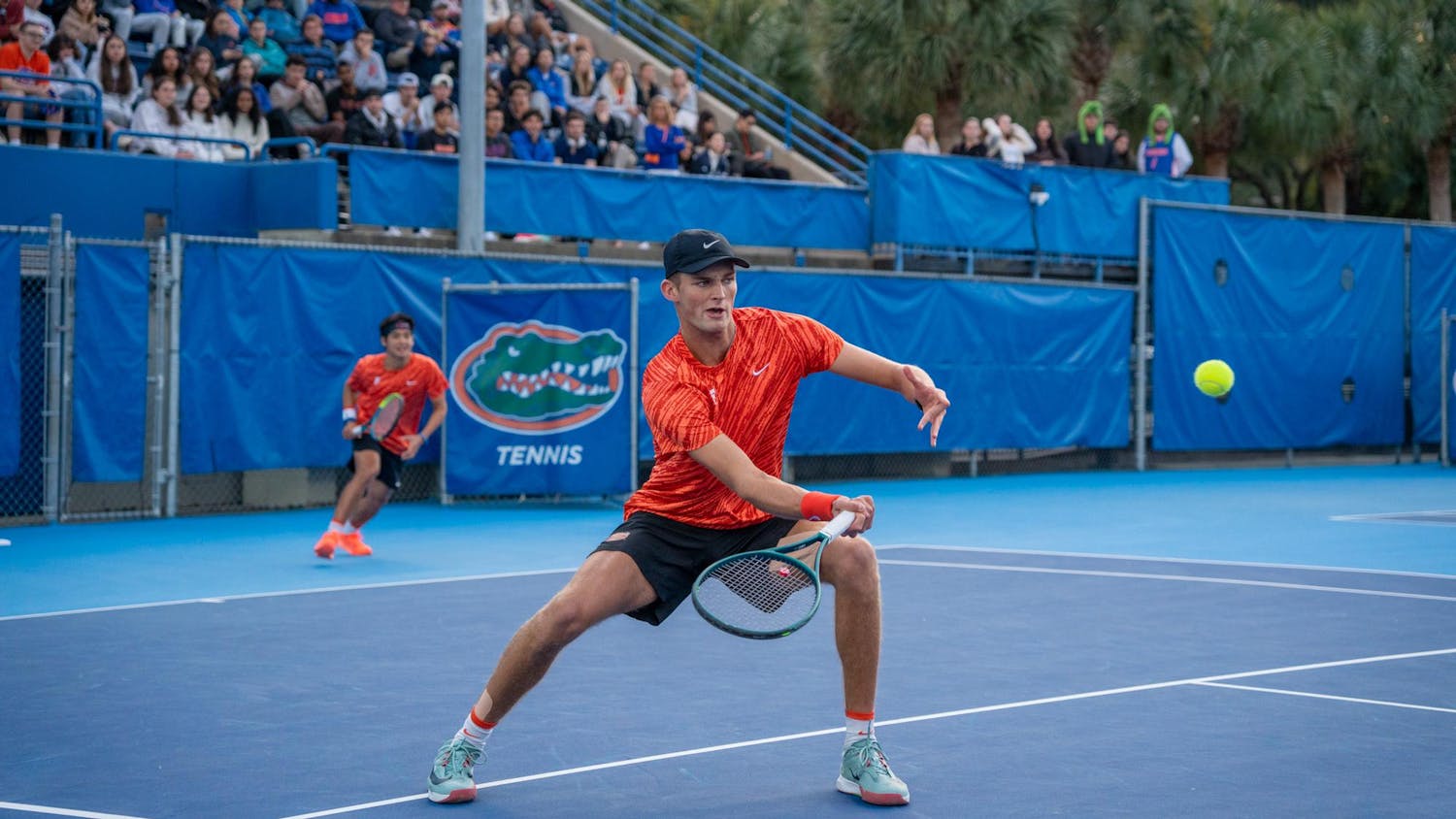 Florida’s Henry Johnson returns the ball during an NCAA men's doubles tennis match against Florida State in Gainesville, Fla. Friday, Jan 30, 2026.