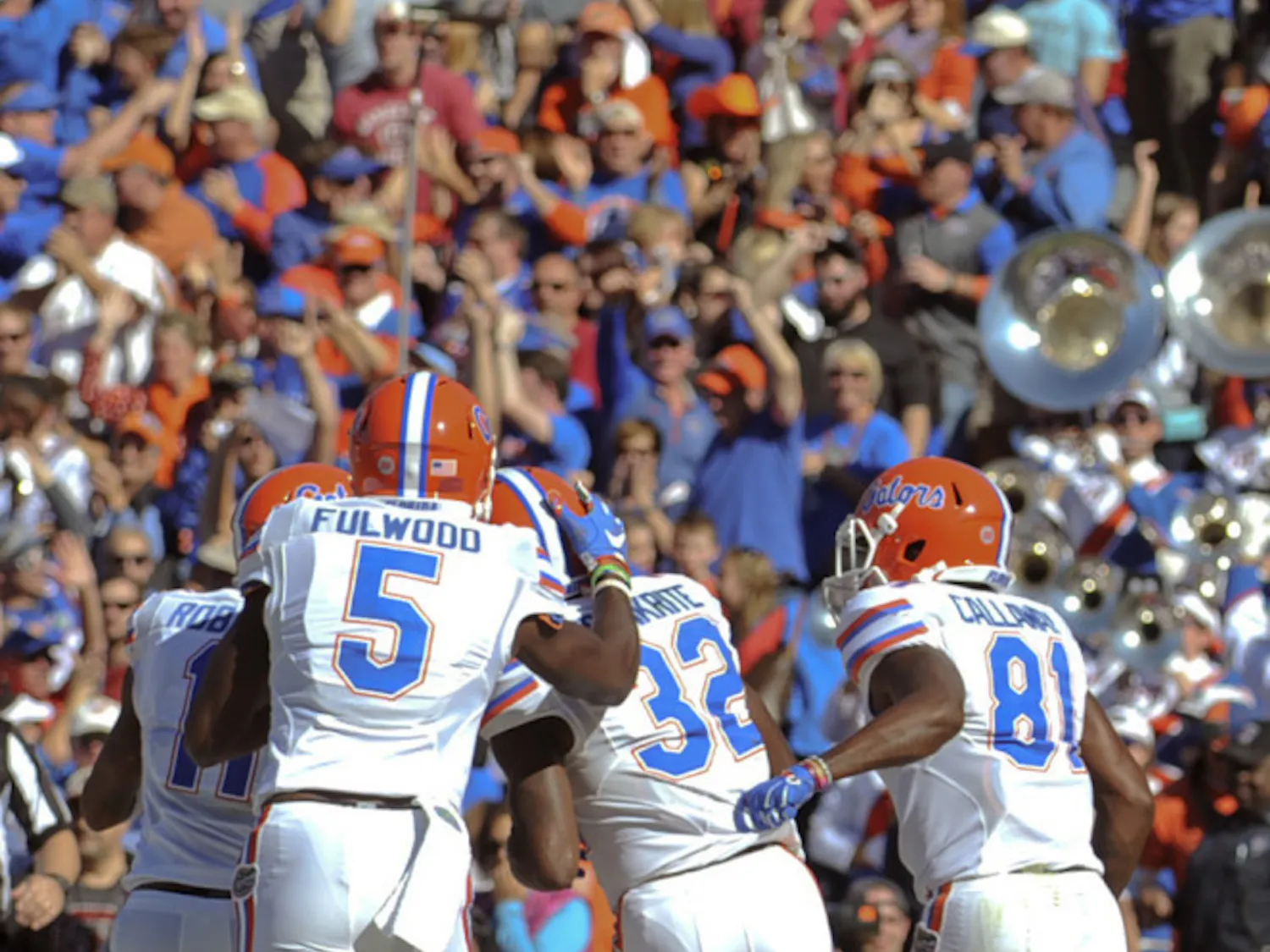 UF players celebrate with running back Jordan Cronkrite after his 41-yard touchdown during Florida's 24-14 win against South Carolina on Nov. 14, 2015, at Williams-Brice Stadium in Columbia, South Carolina.