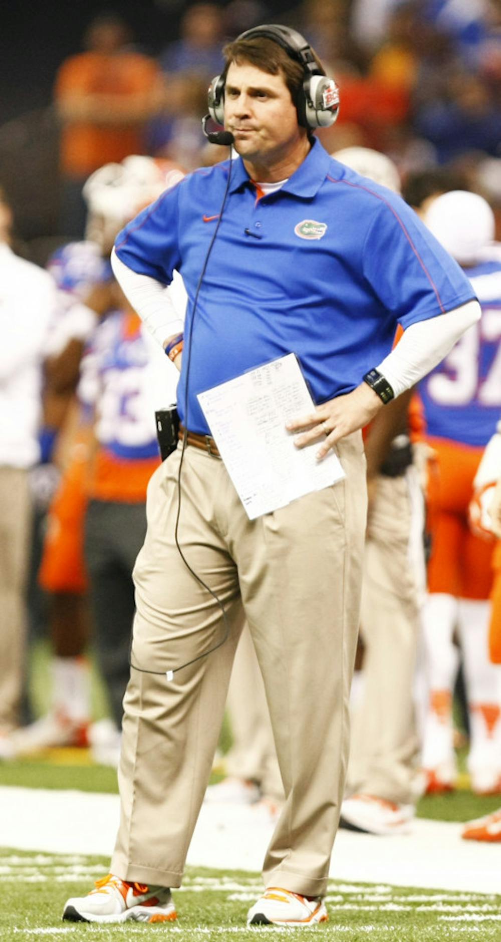 <p>Coach Will Muschamp stands on the field during Florida's 33-23 loss to Louisville on Jan. 2.</p>