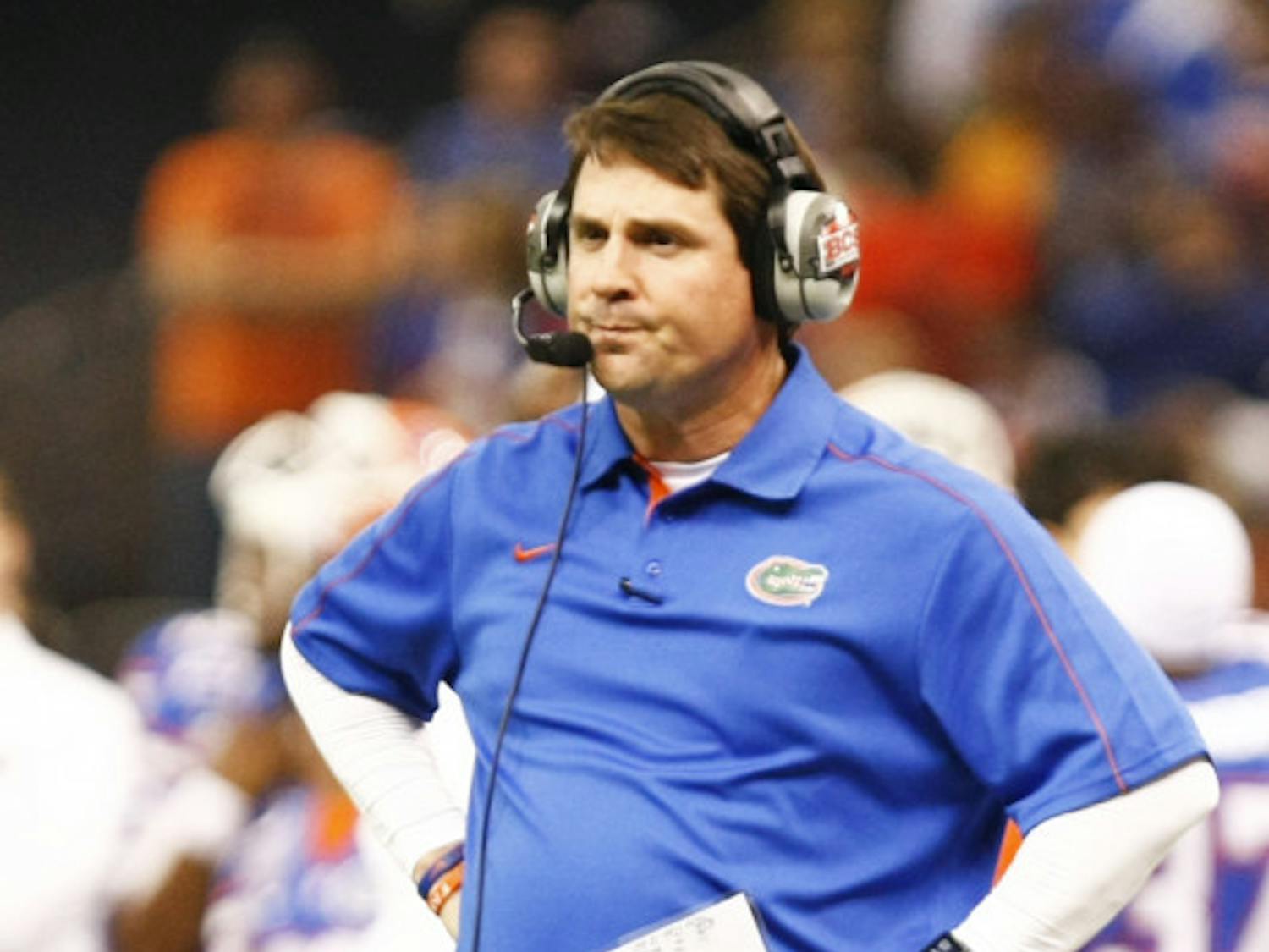 Coach Will Muschamp stands on the field during Florida's 33-23 loss to Louisville on Jan. 2.